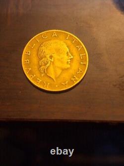 1979 200 Lire Repvbblica Italian coin with mostly Bald head