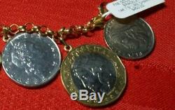MARKED 14k 7.5 YELLOW GOLD CHARM BRACELET WITH 9 LIRE ITALIAN COINS