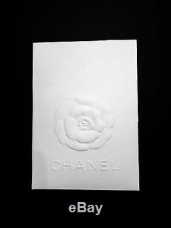 NEW CHANEL classic coin purse, black with gold logo. Never used, in box