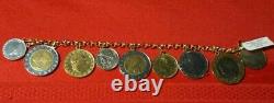 NWT MARKED 14k 7.5 YELLOW GOLD CHARM BRACELET WITH 9 LIRE ITALIAN COINS